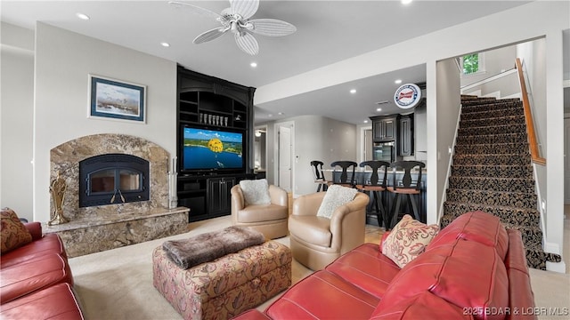 207 Buck Deer Ln, Camdenton, MO 65020 - living area with stairs, ceiling fan, a fireplace, and recessed lighting