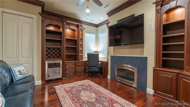 207 Buck Deer Ln, Camdenton, MO 65020 - living room with ornamental molding, visible vents, heating unit, a ceiling fan, and dark wood-style floors