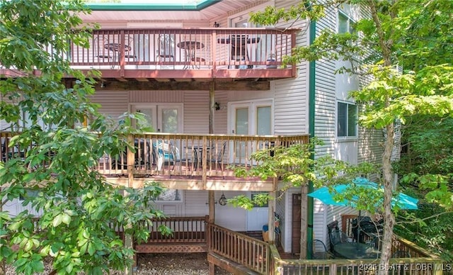 back of property with a balcony