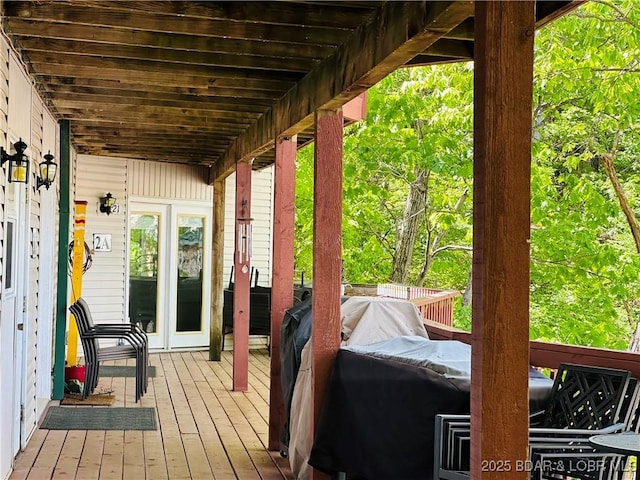 wooden terrace featuring area for grilling