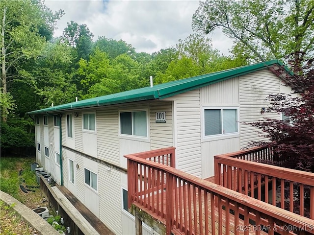 back of house featuring a deck