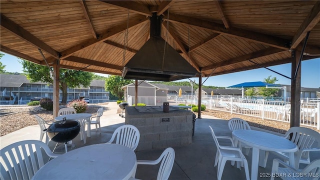 611 Lazy Days Rd Unit L5, Osage Beach, MO 65065 - view of patio / terrace featuring fence, outdoor dining space, and a residential view