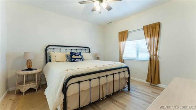 611 Lazy Days Rd Unit L5, Osage Beach, MO 65065 - bedroom featuring ceiling fan, baseboards, visible vents, and light wood-style floors