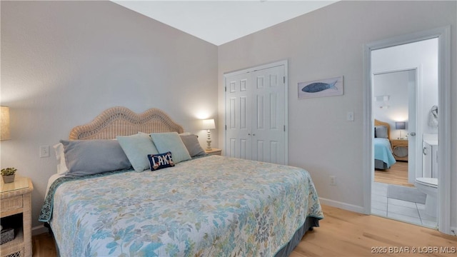 611 Lazy Days Rd Unit L5, Osage Beach, MO 65065 - bedroom featuring light wood-style flooring, a closet, and baseboards
