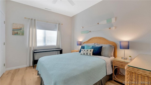 611 Lazy Days Rd Unit L5, Osage Beach, MO 65065 - bedroom featuring wood finished floors, baseboards, and ceiling fan