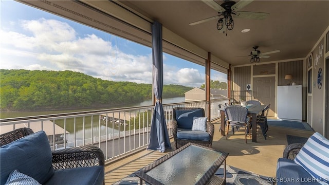 611 Lazy Days Rd Unit L5, Osage Beach, MO 65065 - wooden terrace with a wooded view, a water view, and a ceiling fan