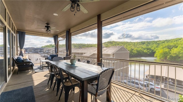 611 Lazy Days Rd Unit L5, Osage Beach, MO 65065 - view of patio / terrace featuring a water view, a view of trees, ceiling fan, and a balcony