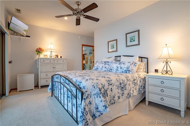 bedroom featuring a ceiling fan, light carpet, and visible vents