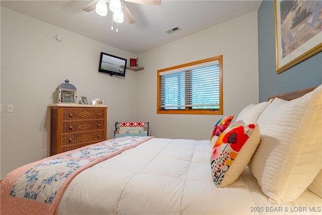 bedroom featuring ceiling fan and visible vents