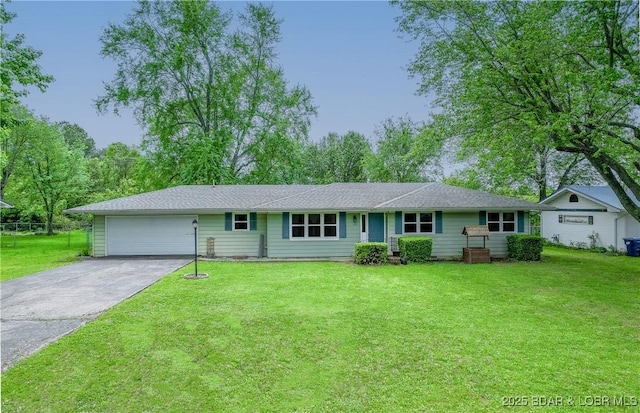 ranch-style house with a front lawn, driveway, and a garage