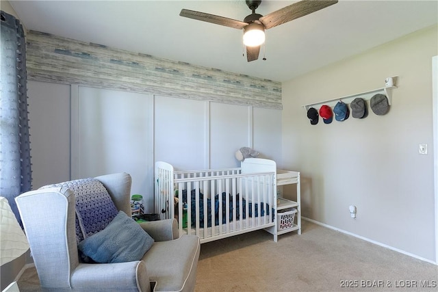 bedroom with carpet, baseboards, and a ceiling fan