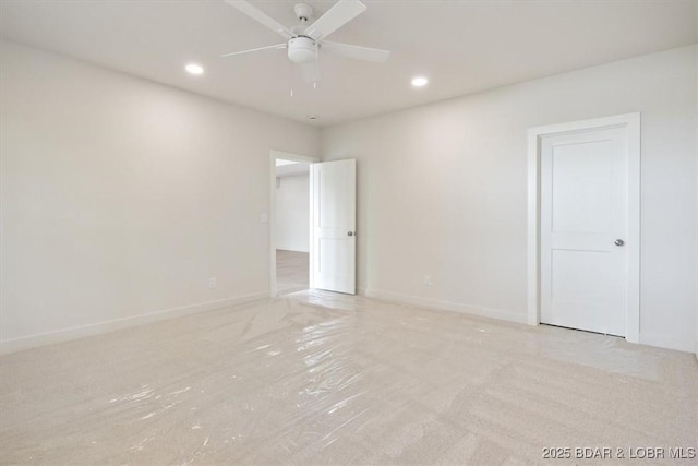 unfurnished room with recessed lighting, ceiling fan, and baseboards