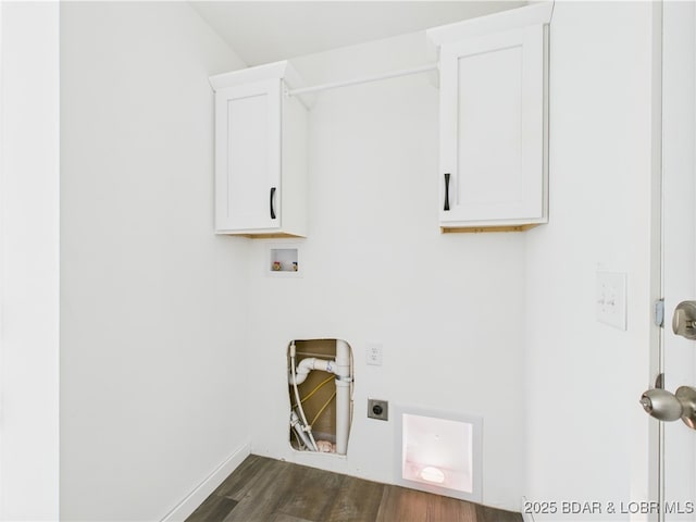 clothes washing area with dark wood-style flooring, hookup for an electric dryer, cabinet space, and washer hookup