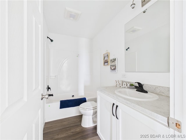 full bath with vanity, toilet, shower / bathtub combination, and wood finished floors