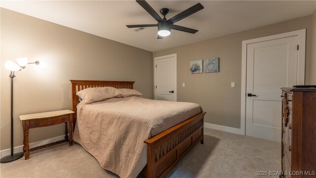 484 Hogan Dr, Lake Ozark, MO 65049 - bedroom featuring light colored carpet, baseboards, and a ceiling fan