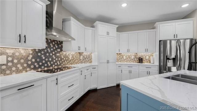 484 Hogan Dr, Lake Ozark, MO 65049 - kitchen featuring stainless steel refrigerator with ice dispenser, wall chimney exhaust hood, black electric stovetop, white cabinets, and light stone counters