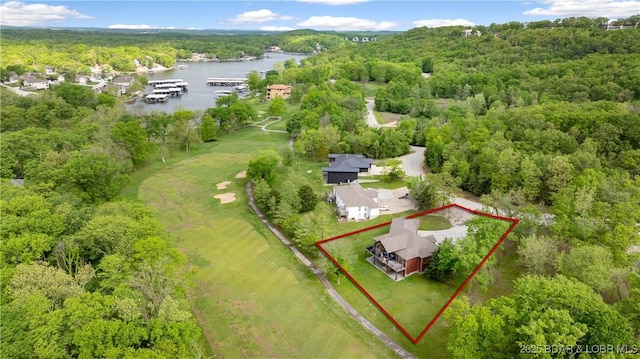 484 Hogan Dr, Lake Ozark, MO 65049 - aerial view of property and surrounding area with a nearby body of water, a forest, and property boundaries highlighted
