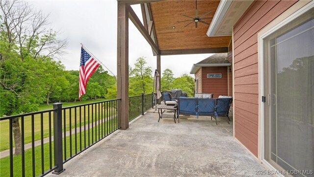 484 Hogan Dr, Lake Ozark, MO 65049 - view of patio / terrace featuring a ceiling fan and an outdoor hangout area