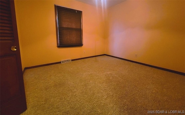 211 Ryan Ave, Tipton, MO 65081 - empty room with carpet flooring, visible vents, and baseboards
