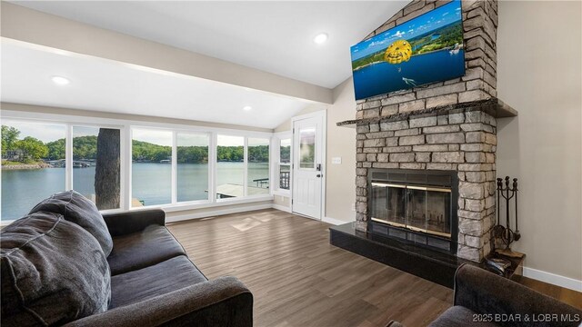 31445 Raytown Dr, Rocky Mount, MO 65072 - living area featuring wood finished floors, a fireplace, baseboards, lofted ceiling, and recessed lighting