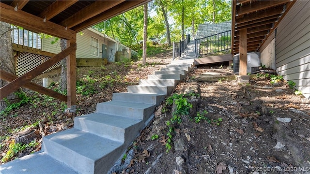 31445 Raytown Dr, Rocky Mount, MO 65072 - view of yard featuring central AC and stairs
