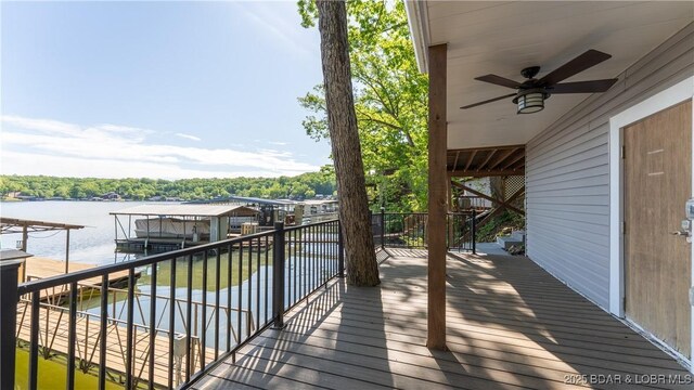 31445 Raytown Dr, Rocky Mount, MO 65072 - deck featuring stairway, a water view, and a ceiling fan