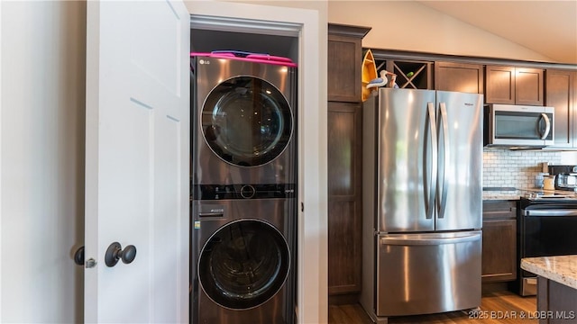 31445 Raytown Dr, Rocky Mount, MO 65072 - laundry room with laundry area, wood finished floors, and stacked washer / drying machine