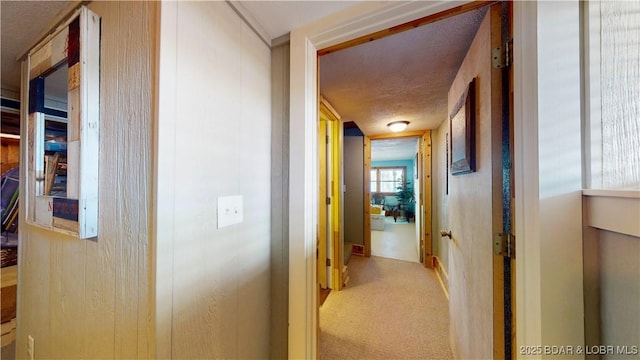 hall with carpet flooring