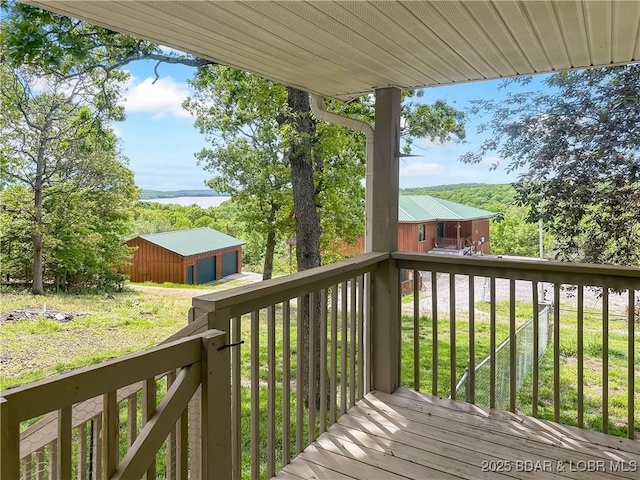 12448 Crestview Dr, Warsaw, MO 65355 - wooden terrace featuring a water view, an outbuilding, and a lawn