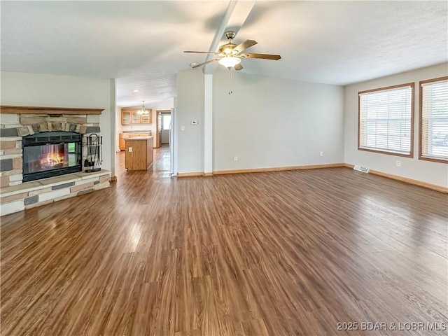 12448 Crestview Dr, Warsaw, MO 65355 - unfurnished living room with wood finished floors, baseboards, ceiling fan, and a fireplace