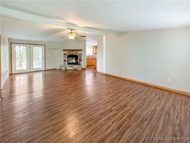 12448 Crestview Dr, Warsaw, MO 65355 - unfurnished living room with baseboards, a fireplace, a ceiling fan, and dark wood-type flooring
