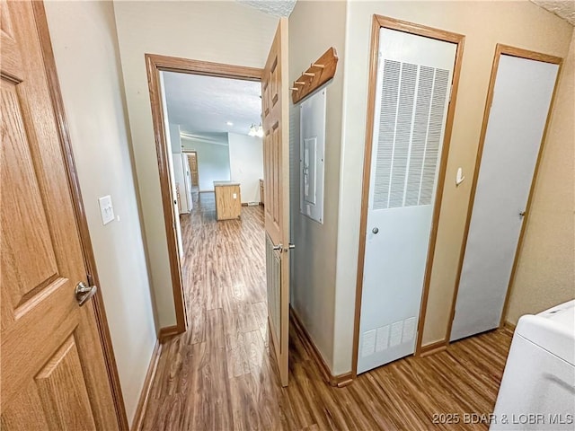 12448 Crestview Dr, Warsaw, MO 65355 - hallway with baseboards, a heating unit, and wood finished floors