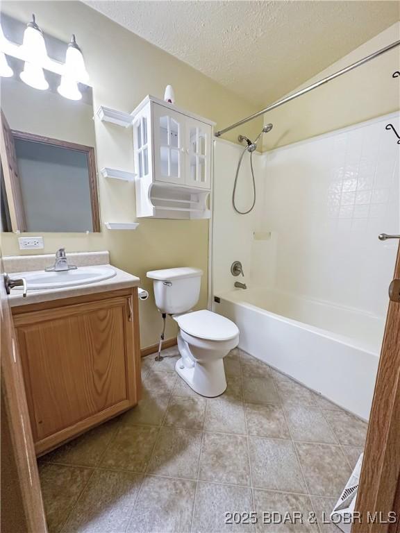 12448 Crestview Dr, Warsaw, MO 65355 - bathroom featuring toilet, shower / washtub combination, vanity, a textured ceiling, and tile patterned floors