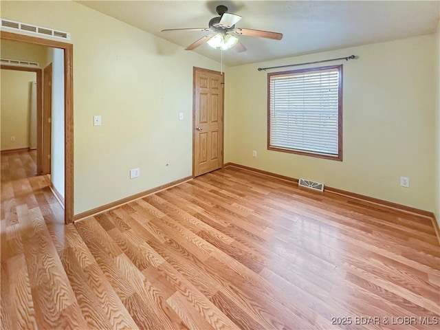 12448 Crestview Dr, Warsaw, MO 65355 - unfurnished room featuring ceiling fan, light wood-style flooring, baseboards, and visible vents
