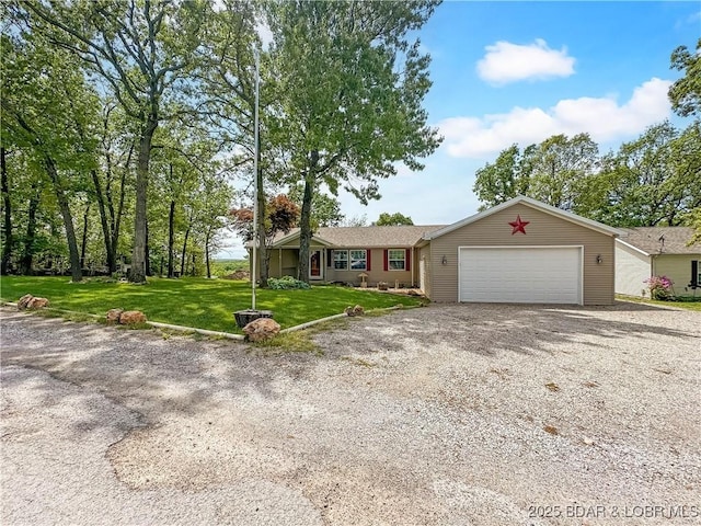 12448 Crestview Dr, Warsaw, MO 65355 - ranch-style home featuring gravel driveway, a front lawn, and a garage
