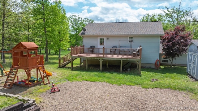 93 Misty Meadows Ln, Camdenton, MO 65020 - back of property with a playground, a lawn, a deck, and roof with shingles