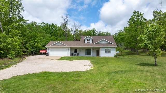 93 Misty Meadows Ln, Camdenton, MO 65020 - view of front of home with gravel driveway, an attached garage, and a front lawn