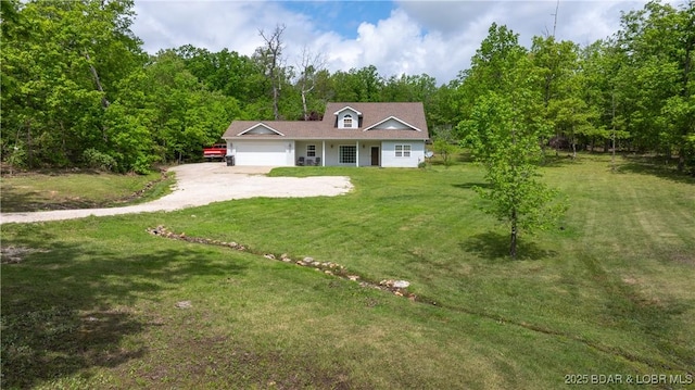 93 Misty Meadows Ln, Camdenton, MO 65020 - view of front of property featuring dirt driveway, an attached garage, and a front lawn