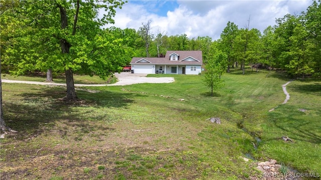 93 Misty Meadows Ln, Camdenton, MO 65020 - view of green lawn featuring an attached garage