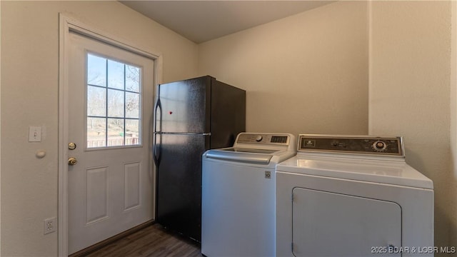 93 Misty Meadows Ln, Camdenton, MO 65020 - clothes washing area featuring separate washer and dryer and dark wood-style flooring