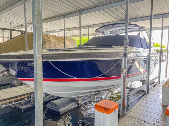 58 Jonathan Dr Unit 4B, Lake Ozark, MO 65049 - dock featuring boat lift