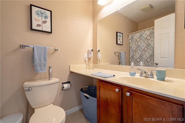 58 Jonathan Dr Unit 4B, Lake Ozark, MO 65049 - full bathroom featuring toilet, tile patterned floors, vanity, baseboards, and a shower with curtain