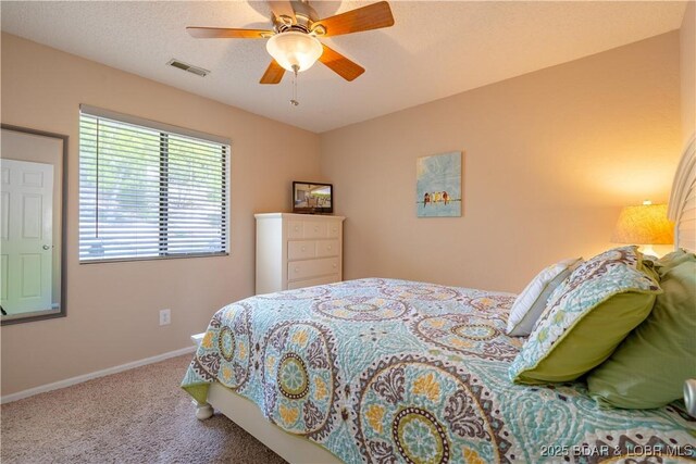 58 Jonathan Dr Unit 4B, Lake Ozark, MO 65049 - bedroom with carpet, baseboards, and a ceiling fan
