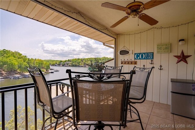 58 Jonathan Dr Unit 4B, Lake Ozark, MO 65049 - balcony featuring a water view, a ceiling fan, and outdoor dining space