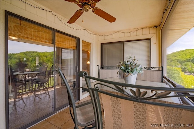 58 Jonathan Dr Unit 4B, Lake Ozark, MO 65049 - sunroom with tile patterned flooring and a ceiling fan