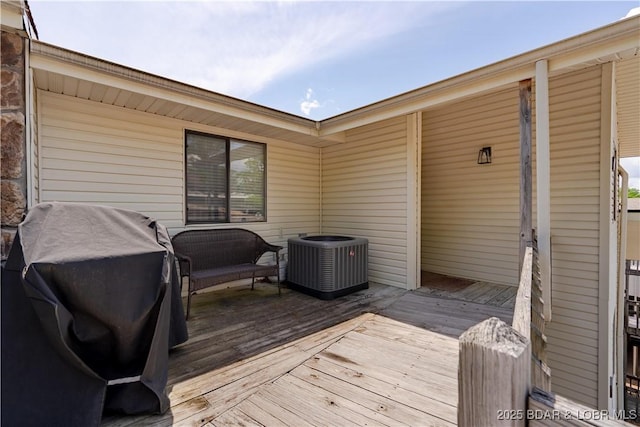 58 Jonathan Dr Unit 4B, Lake Ozark, MO 65049 - wooden deck featuring central AC and grilling area