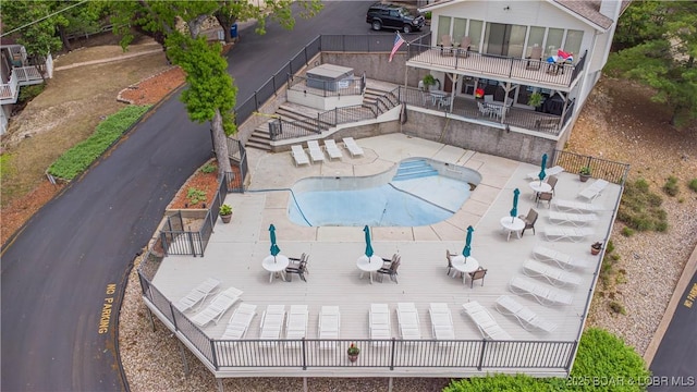 58 Jonathan Dr Unit 4B, Lake Ozark, MO 65049 - community pool featuring outdoor dining area, a deck, and fence