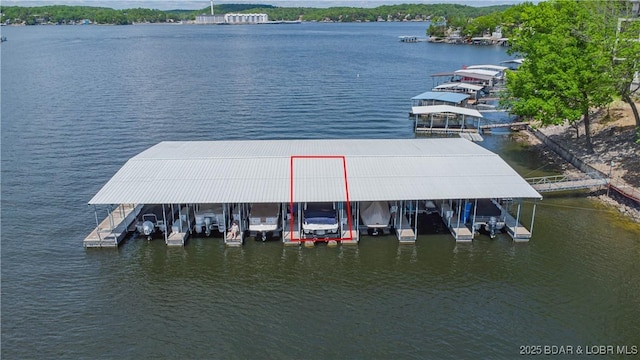 58 Jonathan Dr Unit 4B, Lake Ozark, MO 65049 - dock area featuring boat lift and a water view