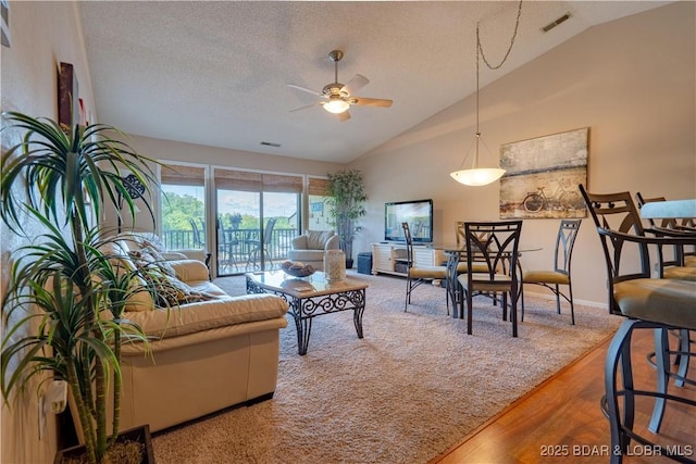58 Jonathan Dr Unit 4B, Lake Ozark, MO 65049 - living room with a ceiling fan, a textured ceiling, wood finished floors, and high vaulted ceiling