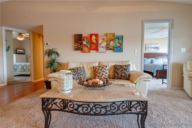 58 Jonathan Dr Unit 4B, Lake Ozark, MO 65049 - living room featuring carpet, a ceiling fan, and baseboards